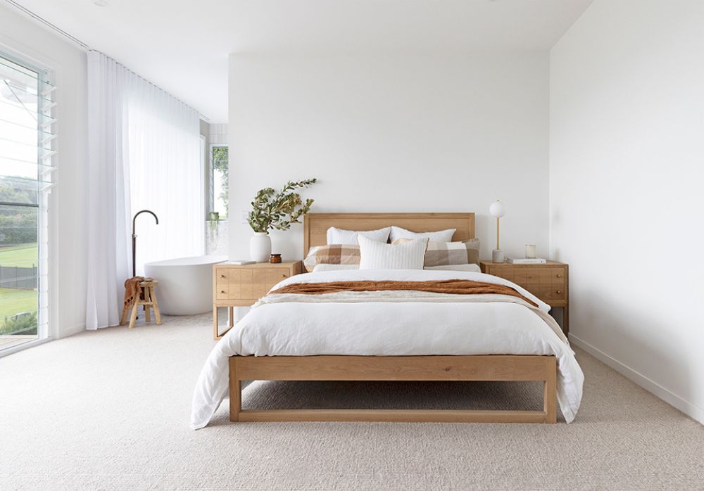 Calm and beautifully styled main bedroom interior demonstrating balanced furniture layout, soft textures and timeless design principles.