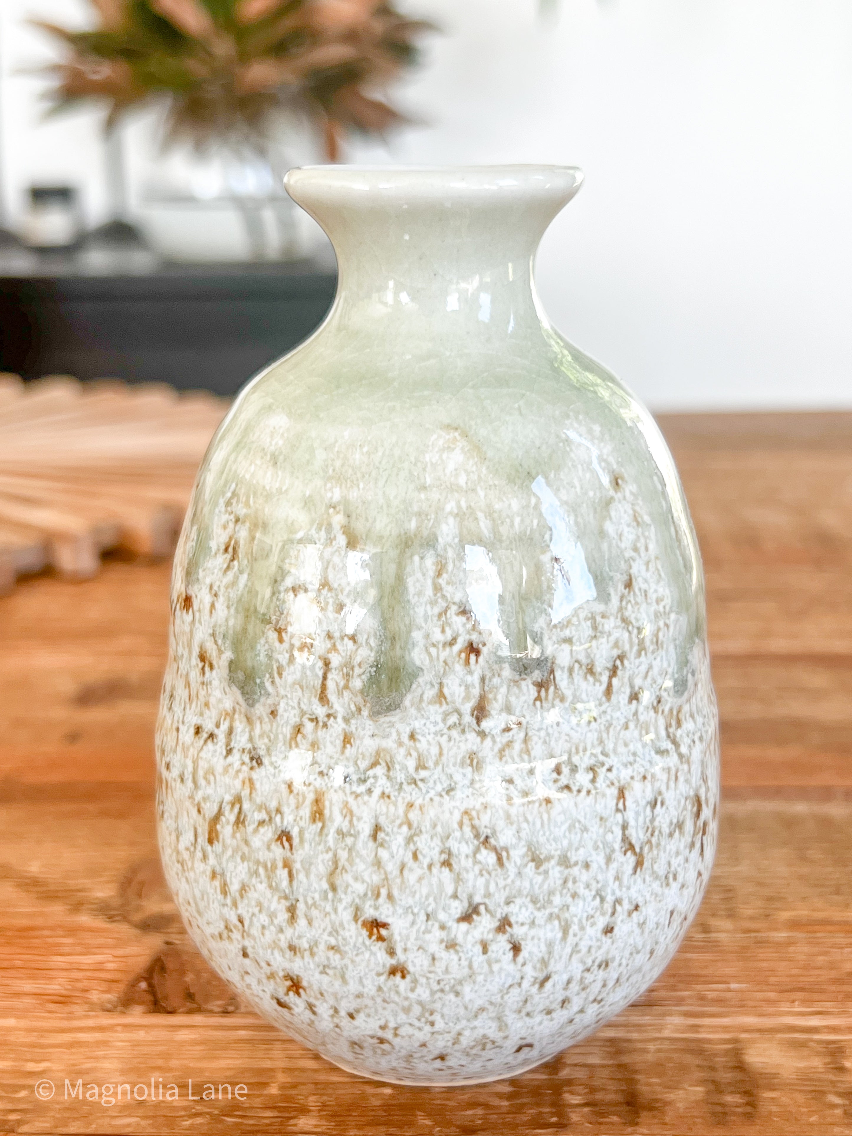 Handcrafted ceramic Sake Jug with light green drip glaze on a speckled finish, makes a perfect little bud vase.