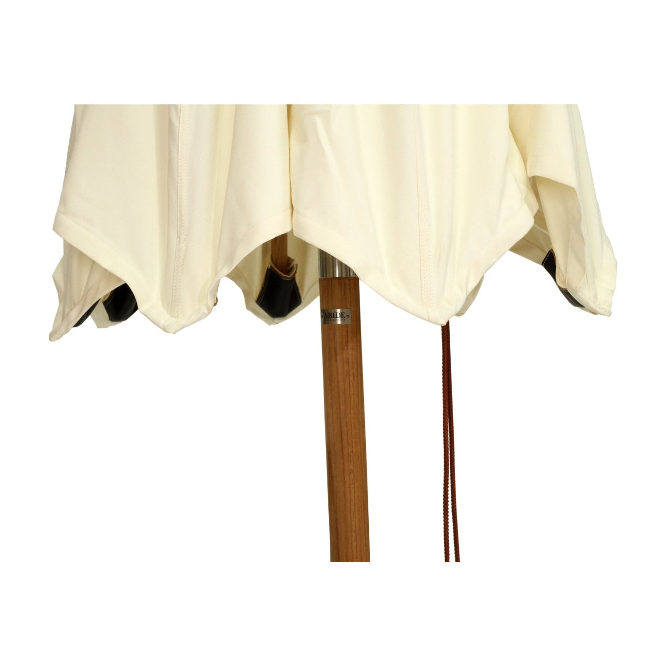 Amalfi Outdoor Parasol with teak pole and marine-grade fittings, round Sunproof Copacobana shade, elegant coastal outdoor umbrella for poolside or garden. Close up.