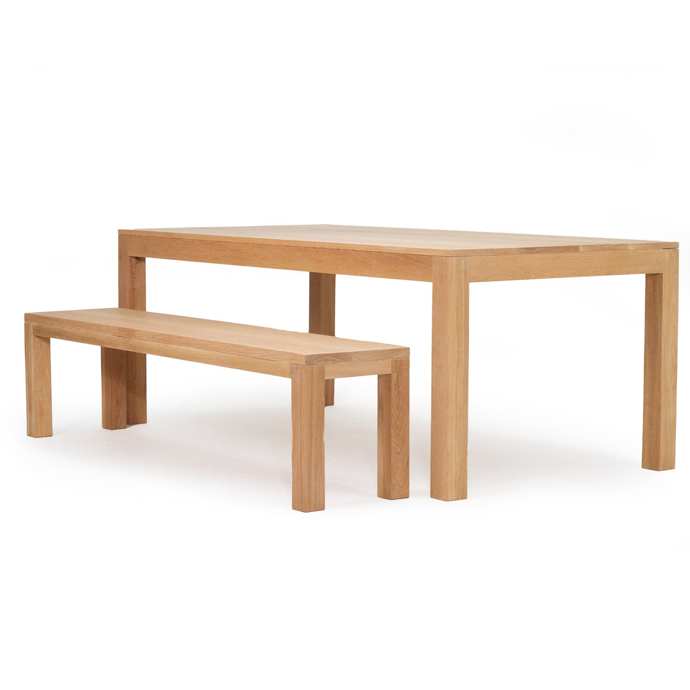 Austin dining table in solid American oak with natural finish and bench angle view