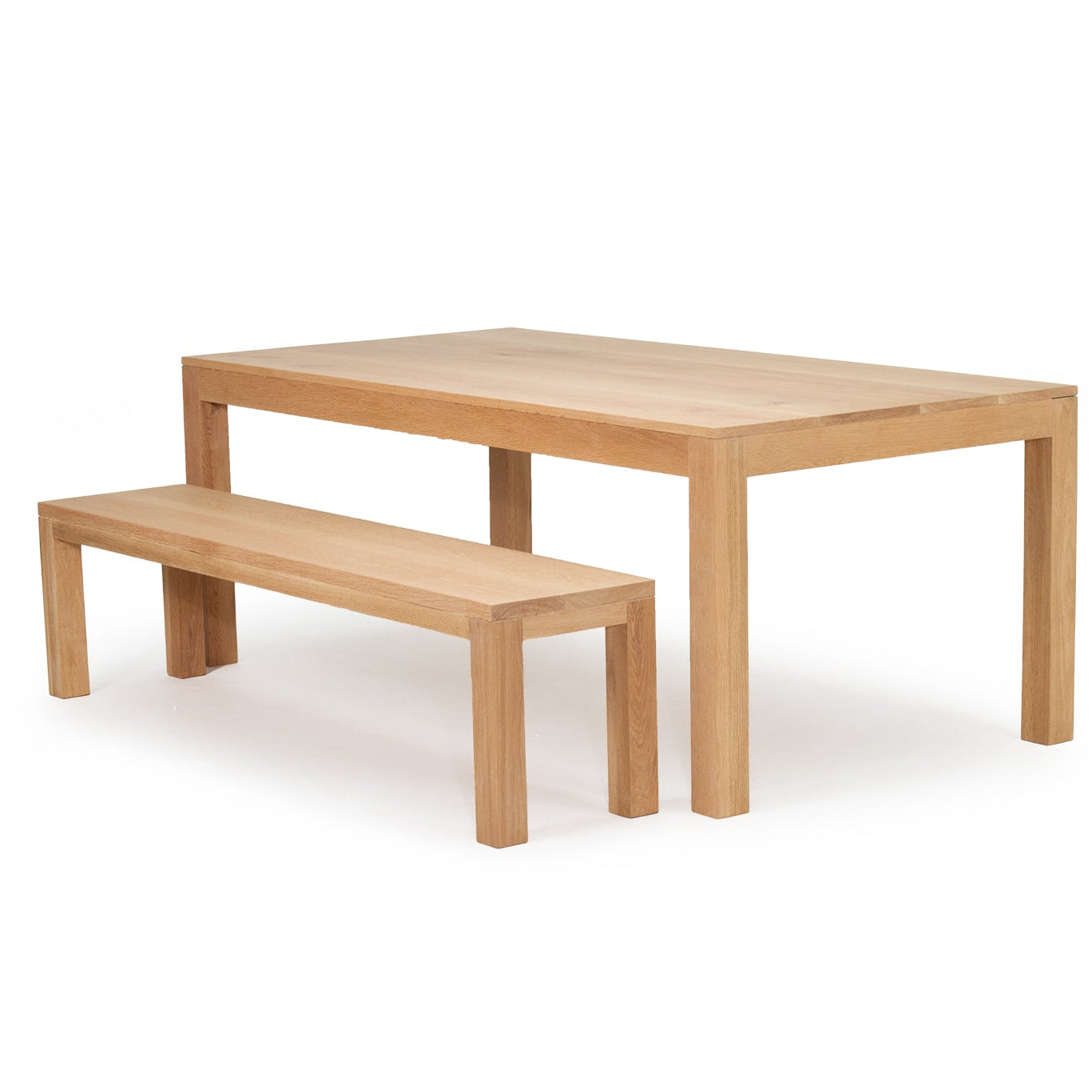 Austin dining table in solid American oak with natural finish and bench slight angle view