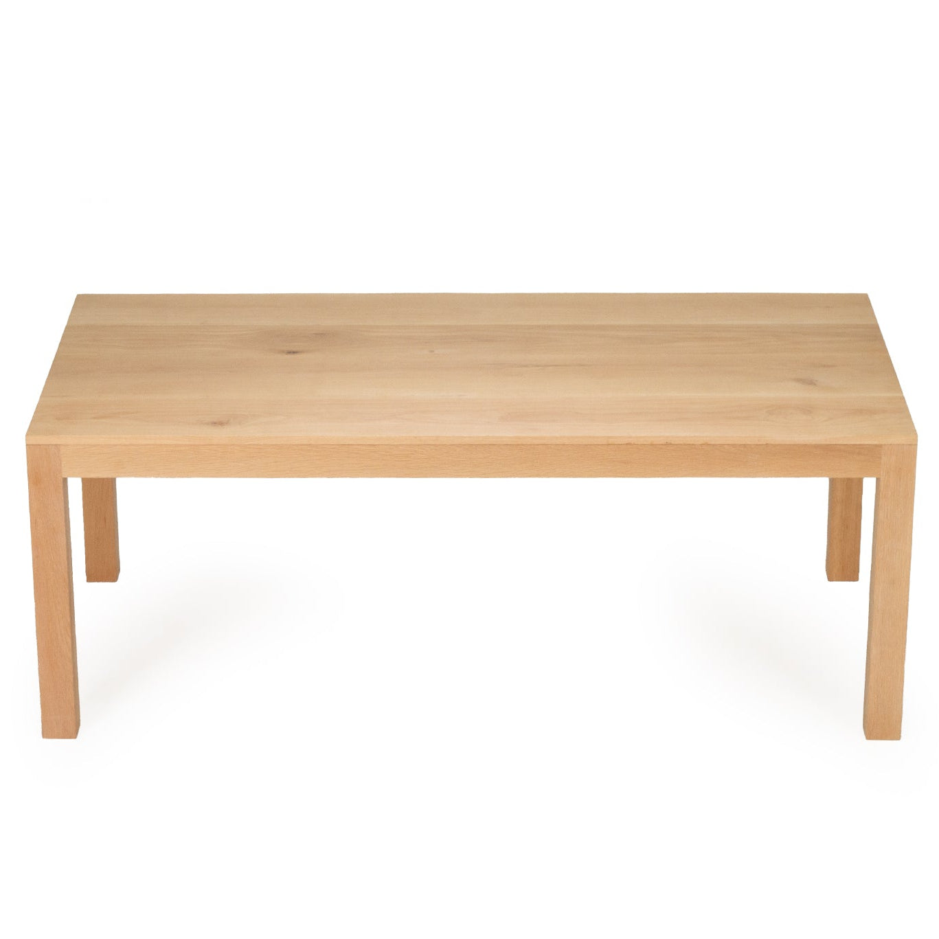 Solid oak dining table with natural finish angled view