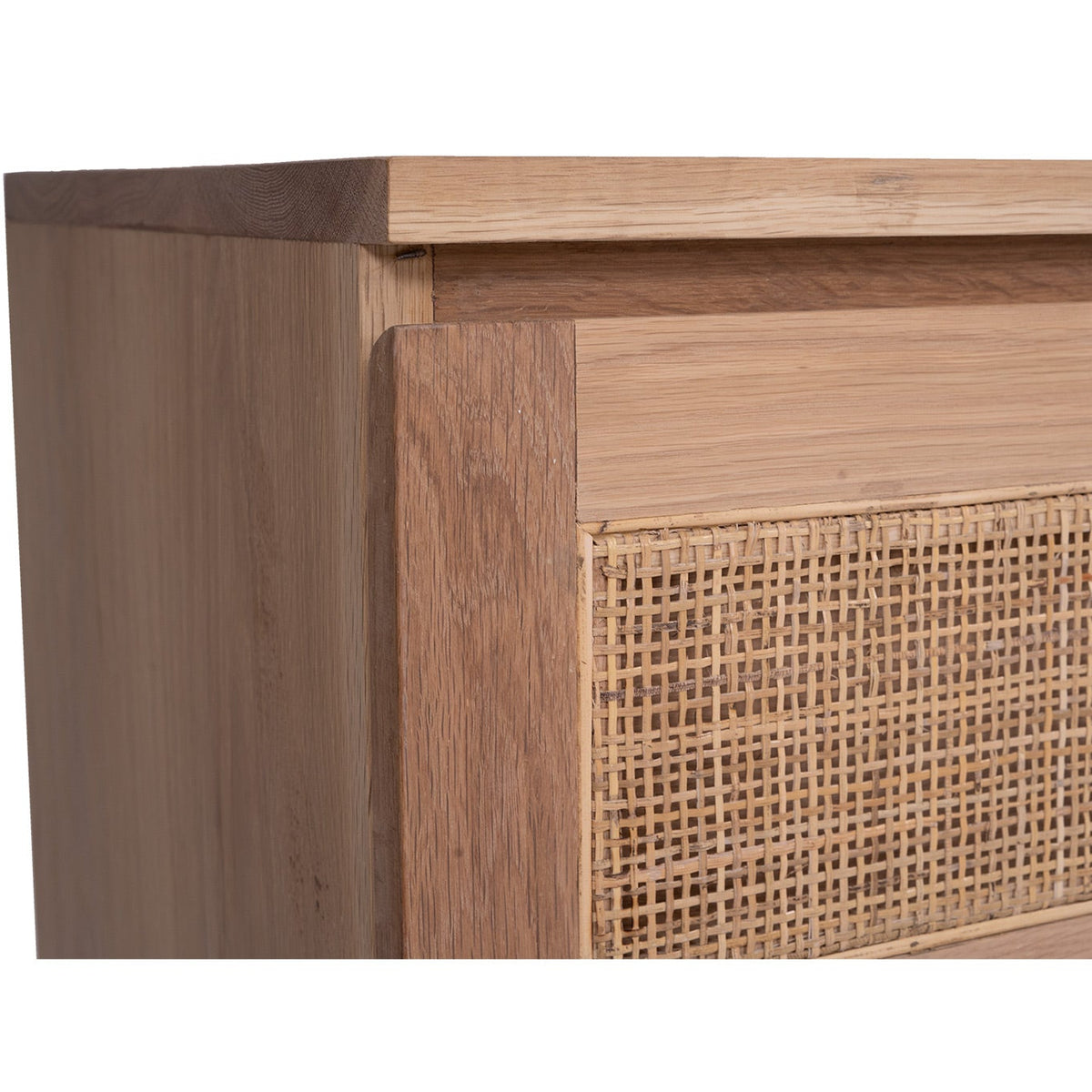 Close-up of the oak drawer edge and woven rattan panel on the Beach House chest