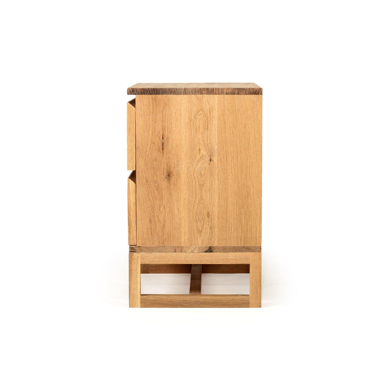 Side profile of the 90 cm Beach House Wide bedside table in natural oak
