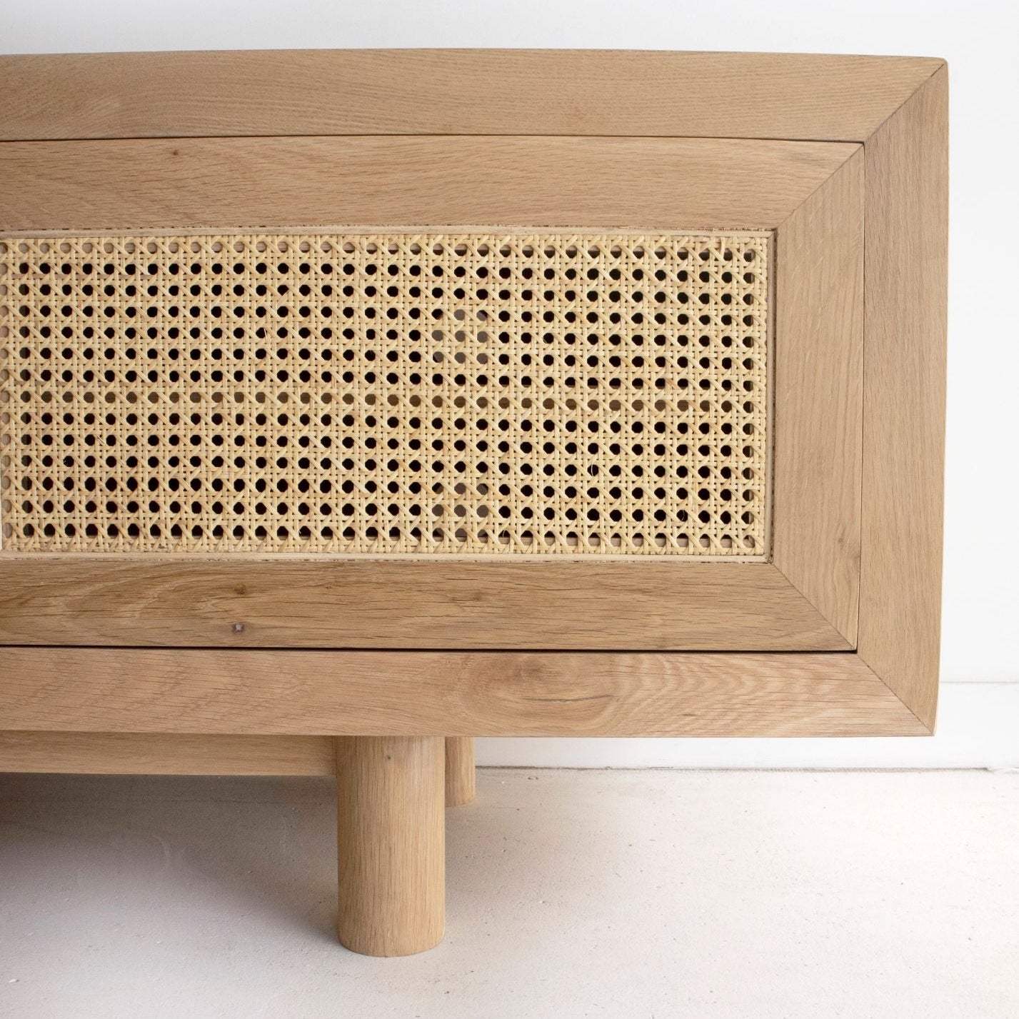 Beach 3 door entertainment unit in solid American oak with rattan doors - corner view