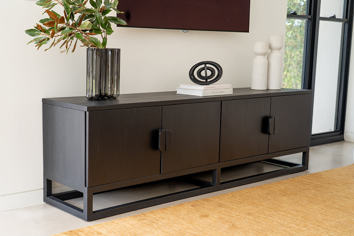 Benji 2m black teak entertainment unit styled with artwork, a vase and decorative objects