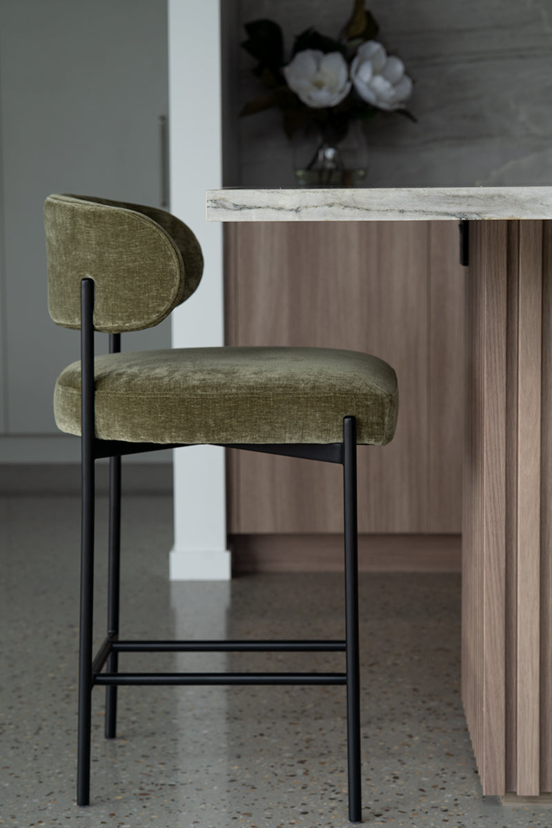 Fontaine Counter Stool with half-moon curved back and metal legs, upholstered in performance velvet in ivy, modern Art Deco inspired counter stool for elegant interiors. Modern style kitchen.