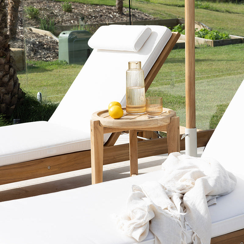 Harbour Island Slim Outdoor Sunlounger in Grade A teak with white Sunbrella cushion, adjustable backrest and wheels, coastal outdoor furniture for poolside or garden relaxation. Resort style living.