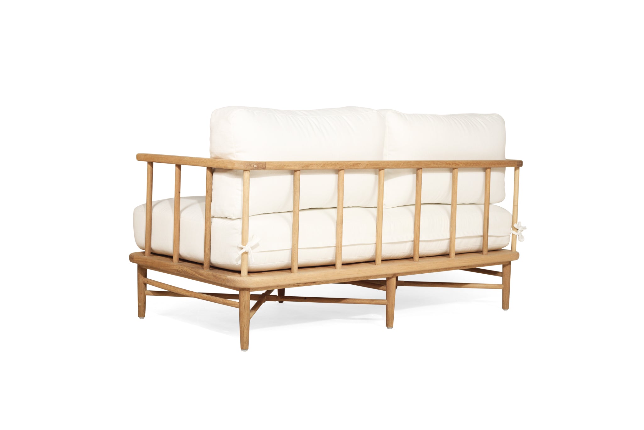 The Harbour Island Two Seater Sofa with light timber frame and white cushions – coastal luxe design perfect for relaxed interiors - back perspective