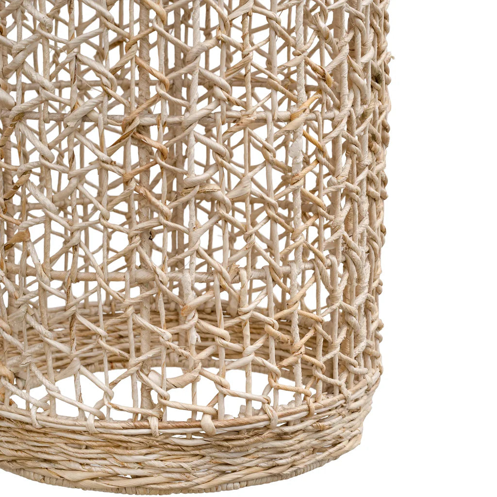 Close-up detail of the Lili Pendant Light base by Uniqwa Collections showing handcrafted banana leaf fibre weaving and natural texture.