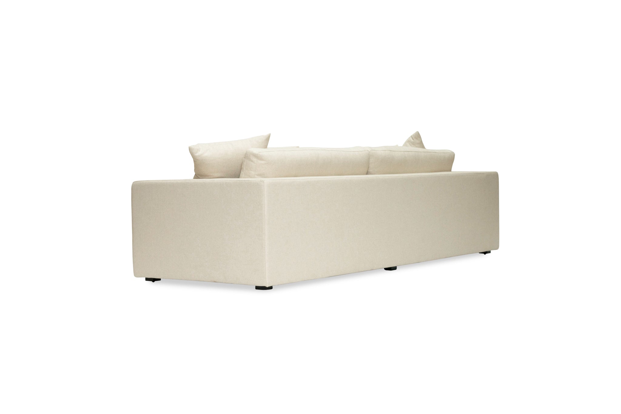 Lucca Four Seater Sofa in performance linen blend upholstery in Dune, refined design, available in boucle oatmeal or saddle leather. Back angle perspective.