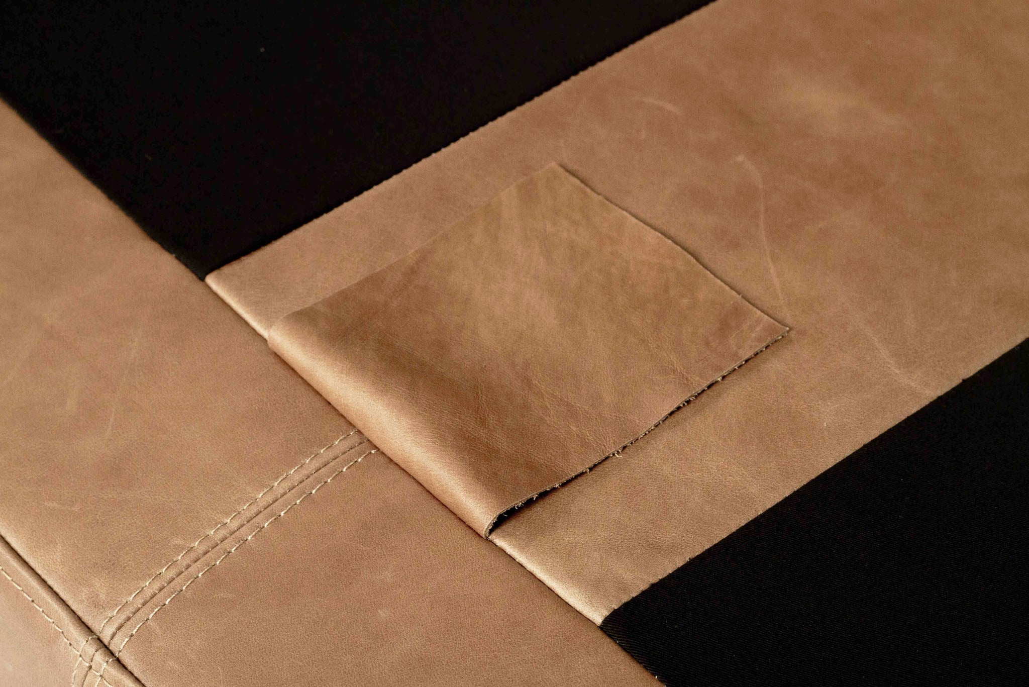 Lucca Four Seater Sofa in trend saddle tan leather with sleek, sophisticated design. Leather close up.