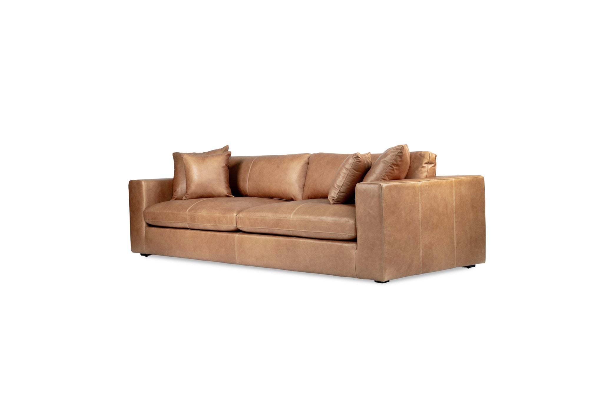 Lucca Four Seater Sofa in trend saddle tan leather with sleek, sophisticated design. Front angle perspective.