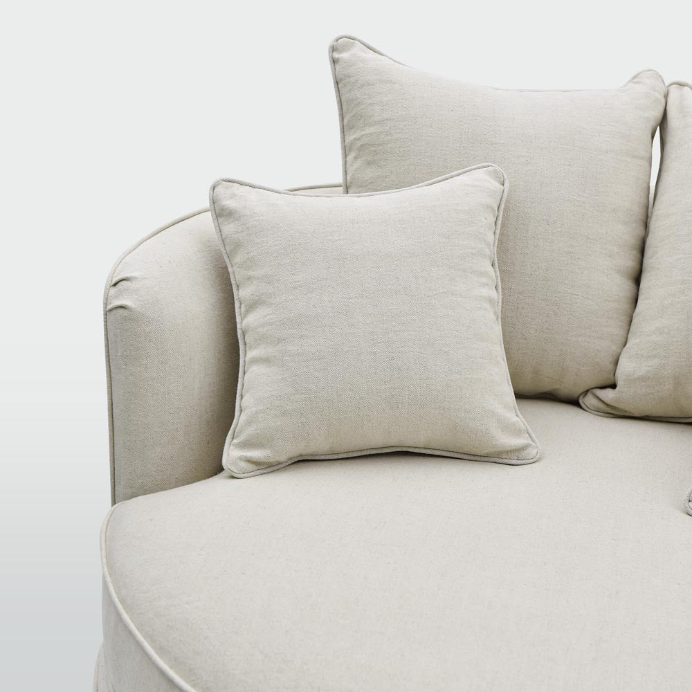 Close-up of beige upholstery and cushions on the Noosa snuggle occasional chair