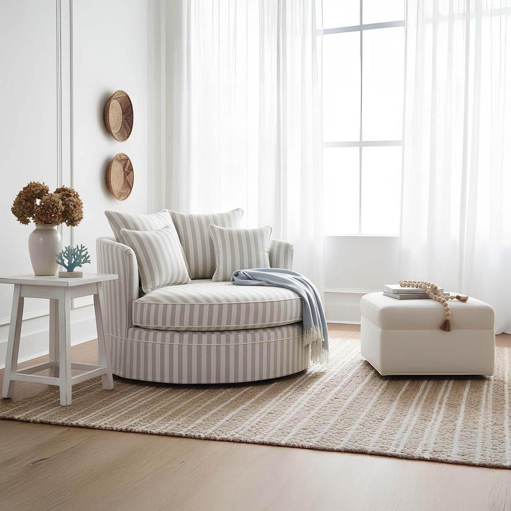 Noosa snuggle occasional chair in Natural Stripe with White Piping, styled beside a window with a side table
