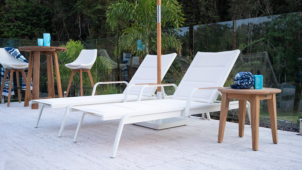Noosa white aluminium Outdoor Sun Lounger styled beside a swimming pool