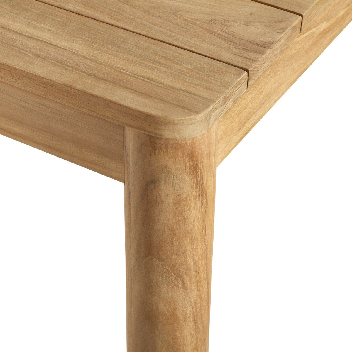 Noosa teak outdoor dining table showing the corner, slatted top and leg detail