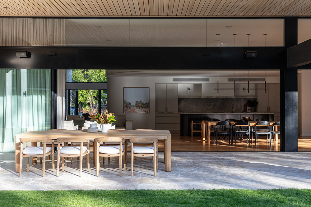 Noosa teak outdoor dining table with timber chairs in a covered alfresco area
