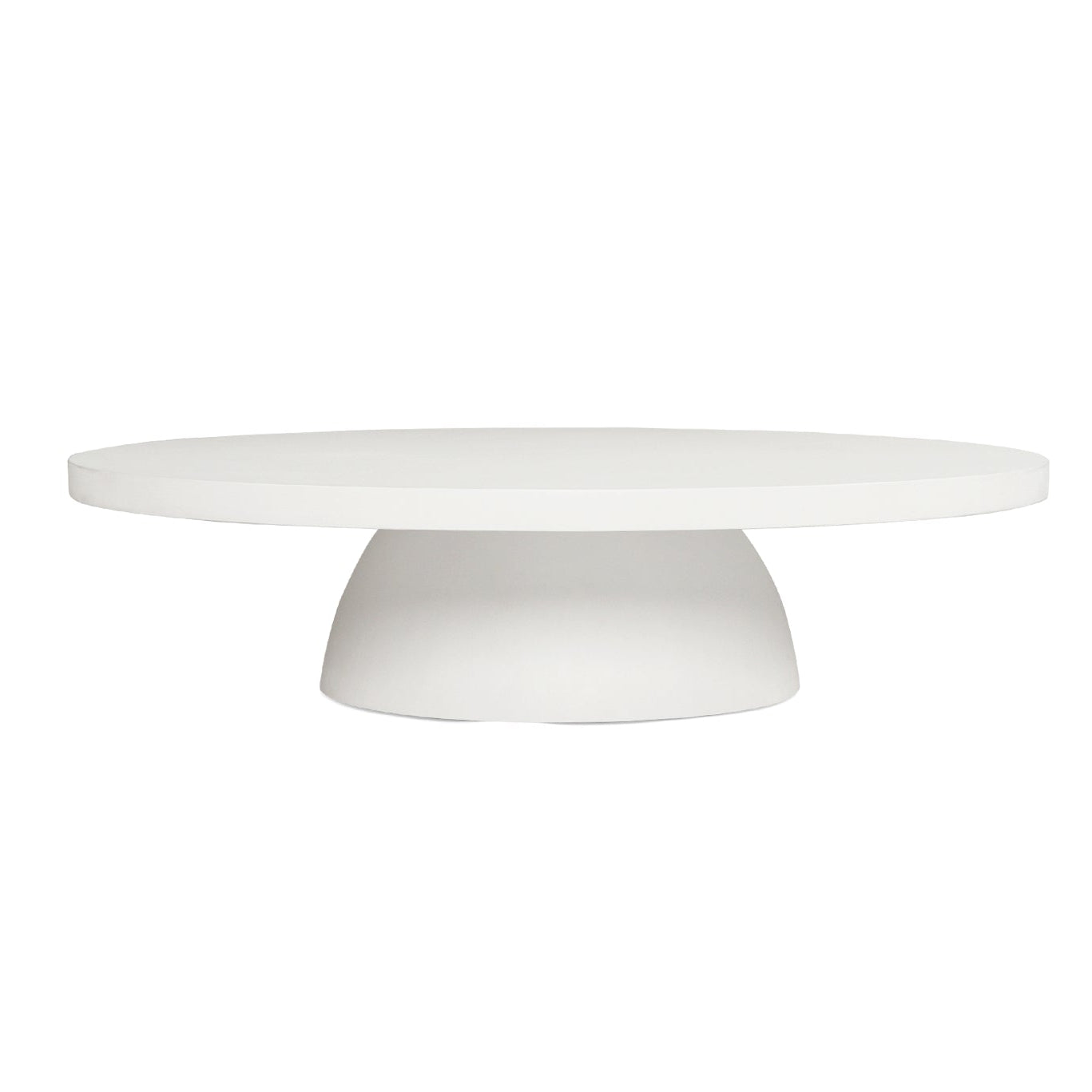 Side view of the Oasis Coffee Table featuring a minimalist white microcement finish and rounded profile.