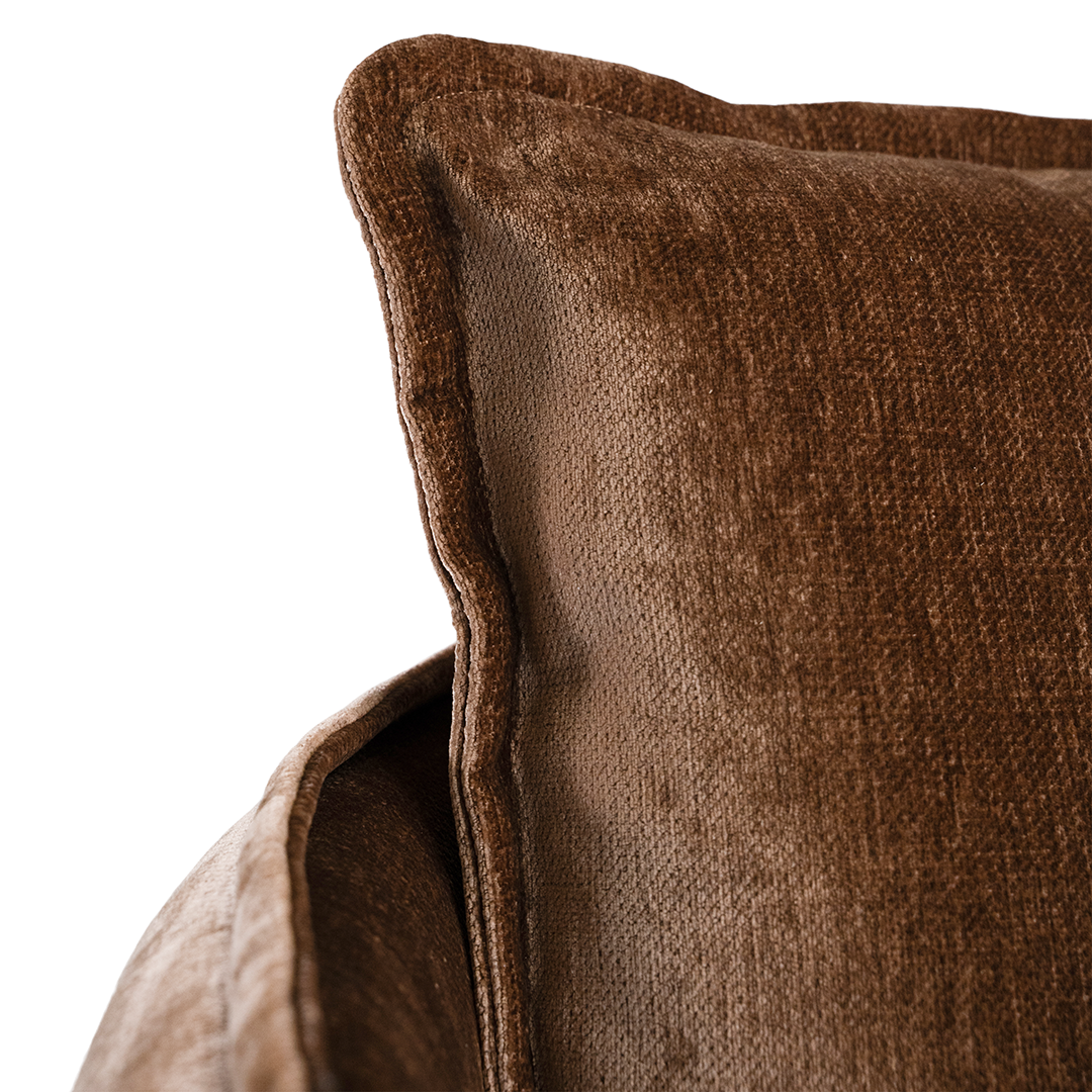 Close-up of the refined bronze fabric upholstery and cushion detailing on the Sabora Swivel Chair. Back cushion.