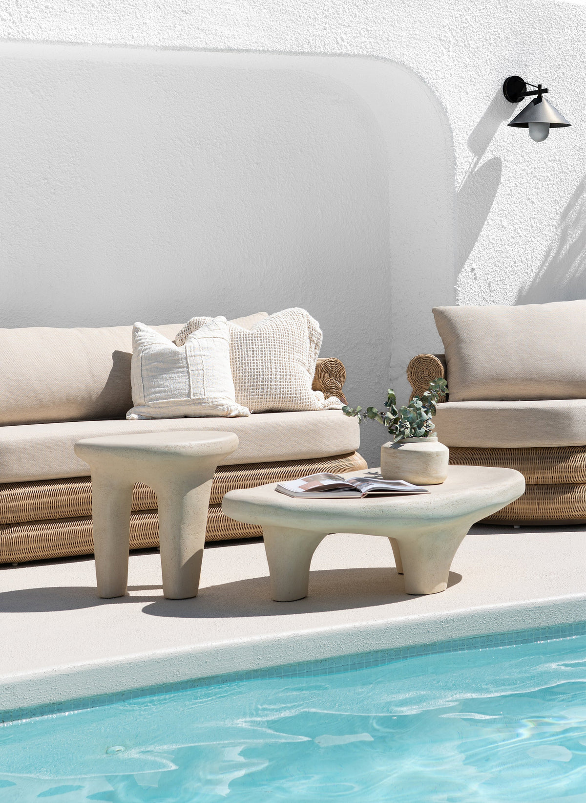 Satori outdoor collection with woven seating and sculptural tables, poolside detail