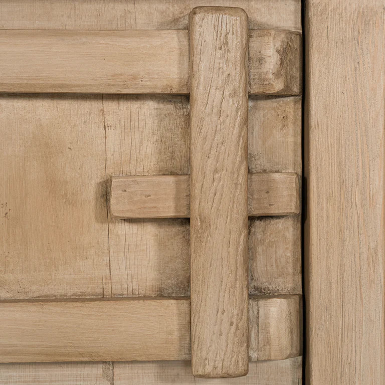 Bulu Bedside Table with left-hand door, handcrafted from reclaimed timber with natural weathered texture and carved details, coastal organic furniture with timeless character. Close up 2.