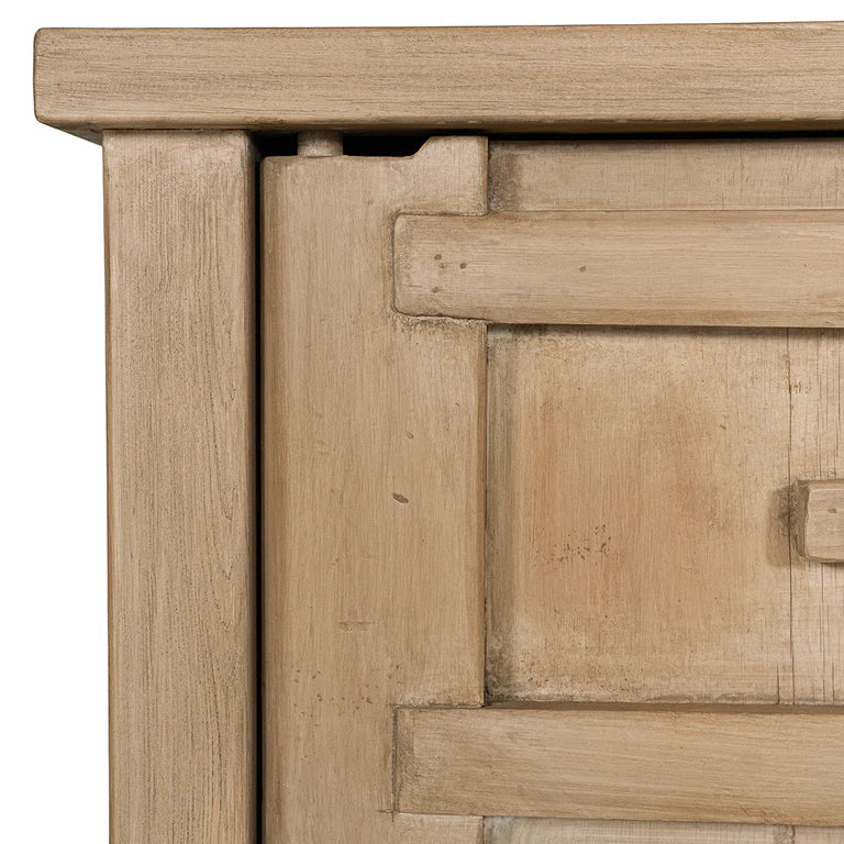 Bulu Bedside Table with left-hand door, handcrafted from reclaimed timber with natural weathered texture and carved details, coastal organic furniture with timeless character. Close up 3.
