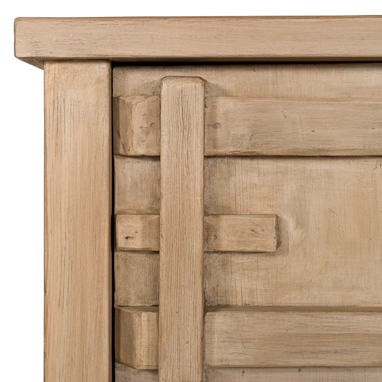 Bulu Bedside Table with right-hand door, handcrafted from reclaimed timber with natural weathered texture and carved details, coastal organic furniture with timeless character. Close up 1.