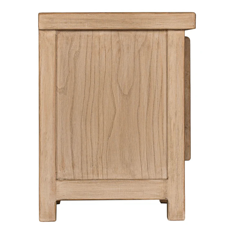 Bulu Bedside Table with right-hand door, handcrafted from reclaimed timber with natural weathered texture and carved details, coastal organic furniture with timeless character. Side view.