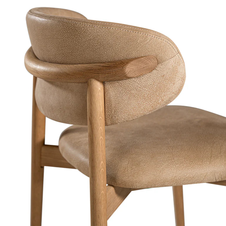 Capri Dining Chair in Enoki by Uniqwa – luxury modern style with buffalo leather upholstery and white oak frame, ideal for refined residential or commercial interiors. Side perspective
