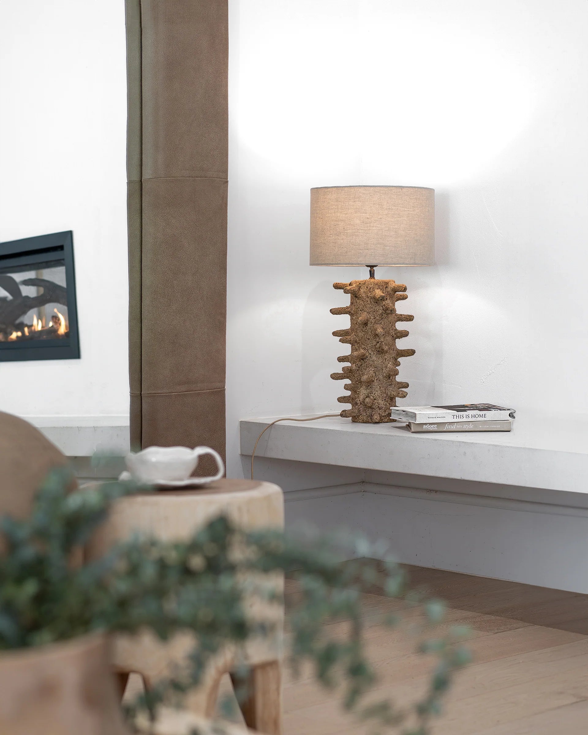 Sula Table Lamp by Uniqwa Collections handcrafted from eco-friendly papier-mâché with an organic spike design, casting a soft ambient glow and unique shadow play.
