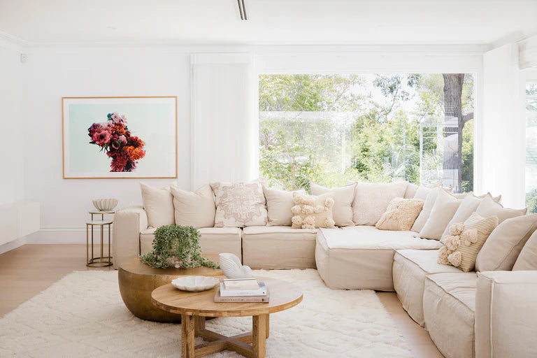 Uniqwa Hendrix sofa suite in sand, with feather cushioning and removable slipcover, timber frame modern coastal sofa with scatter cushions, available in multiple colours. As seen in Three Birds Renovations interior.