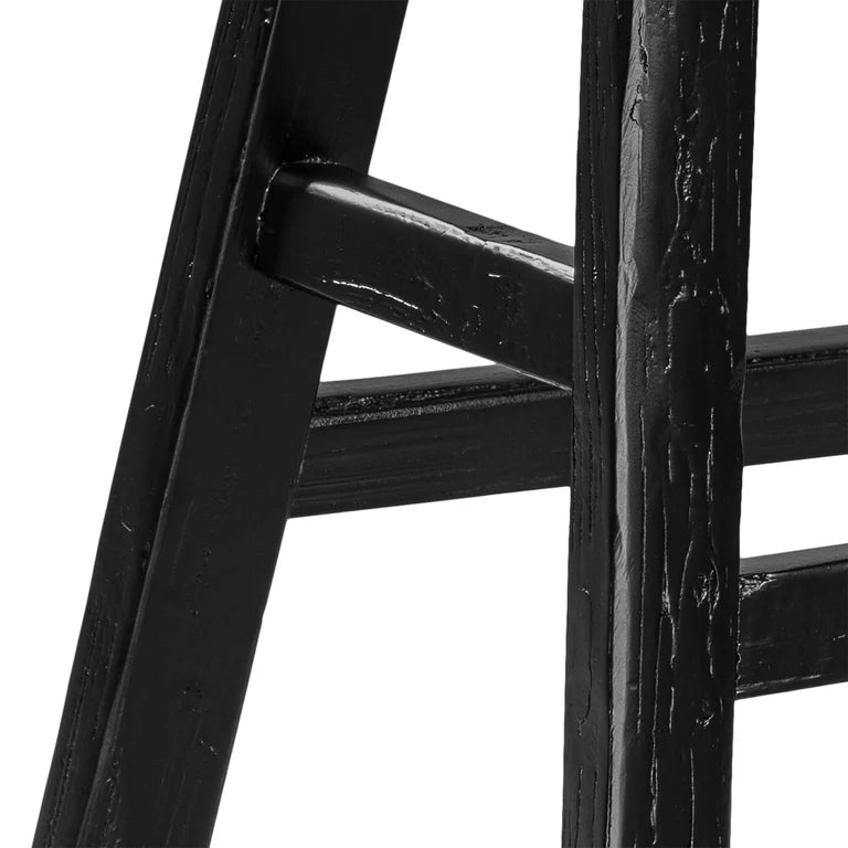 Handmade reclaimed elm wood barstool in a painted black finish, featuring natural variations for a unique coastal or villa style. By Uniwqa Collections, sold by Magnolia Lane Australia wide delivery. Leg detail.