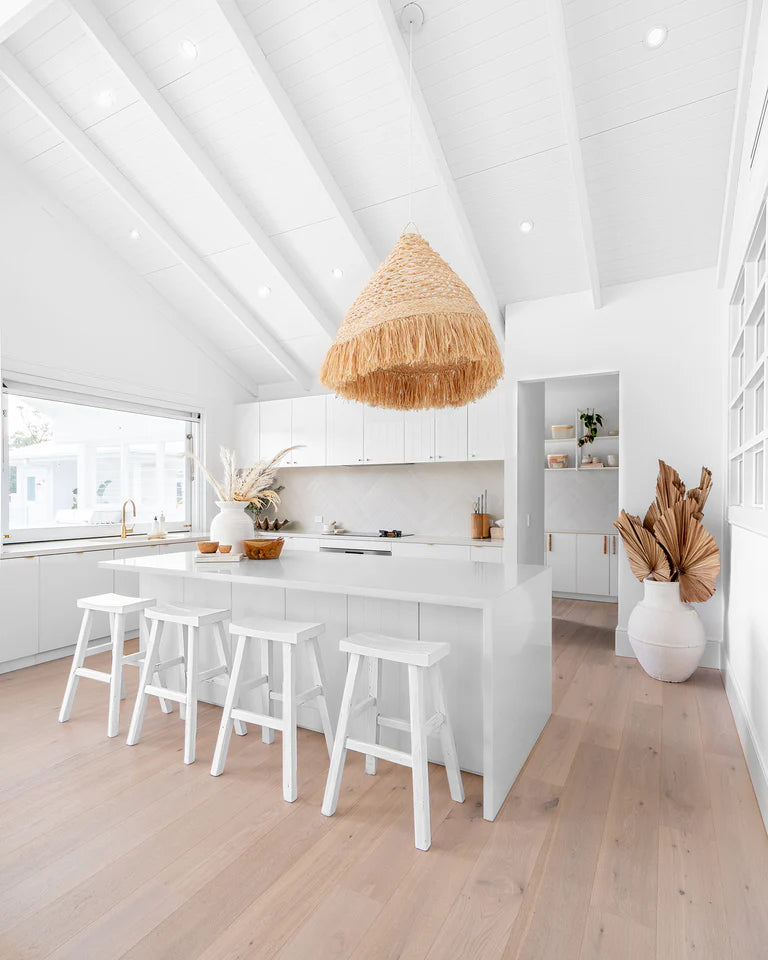 Handmade reclaimed elm wood barstool in a painted white finish, featuring natural variations for a unique coastal or villa style. By Uniwqa Collections, sold by Magnolia Lane Australia wide delivery. Styled beautifully in this modern coastal home.