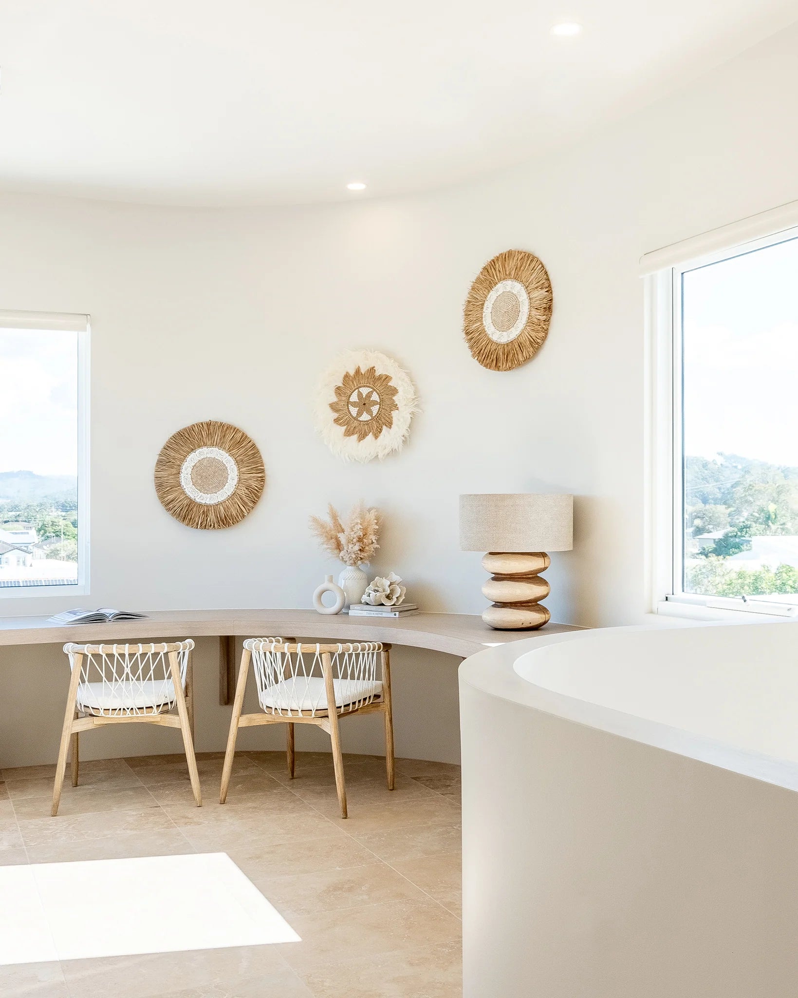 Rundu Table Lamp handcrafted from solid munggur wood with hand-carved textured grooves, showcasing natural wood variations and a soft ambient glow. Styled beautifully in this coastal home.