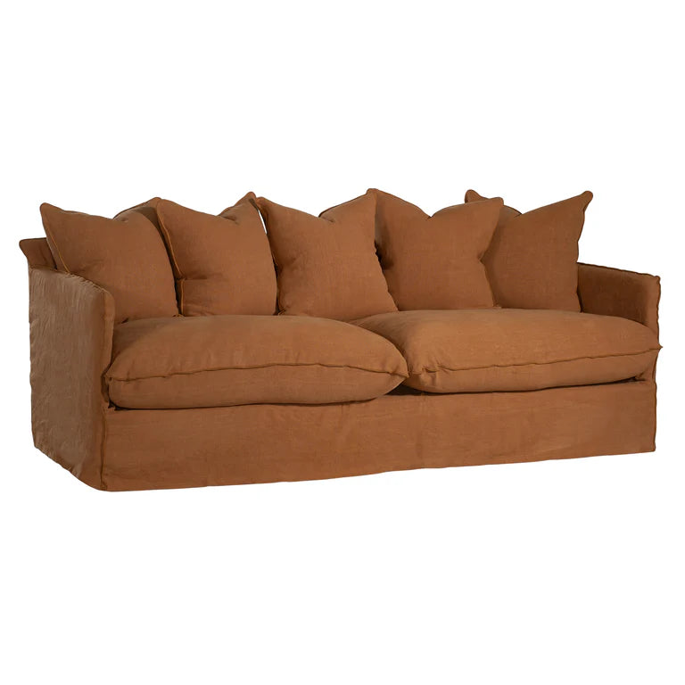 Singita Three Seater Sofa with hardwood frame, feather-filled cushions and removable slipcovers in luxury linen in clay.