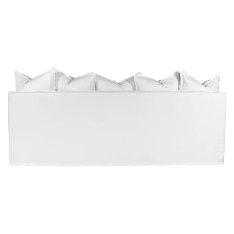 Singita Three Seater Sofa with hardwood frame, feather-filled cushions and removable slipcovers in luxury linen in white. Back perspective.