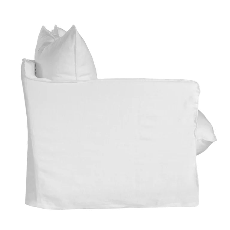 Singita Three Seater Sofa with hardwood frame, feather-filled cushions and removable slipcovers in luxury linen in white. Side perspective.