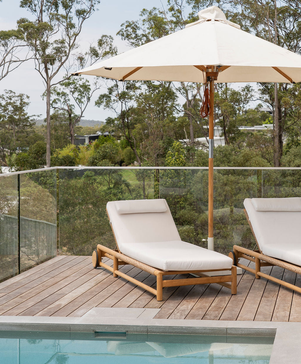 Vaucluse Outdoor Sunlounger in Grade A teak with white Sunbrella cushion, adjustable backrest and wheels, durable coastal outdoor furniture for poolside or garden relaxation. Magnolia Lane coastal style living.