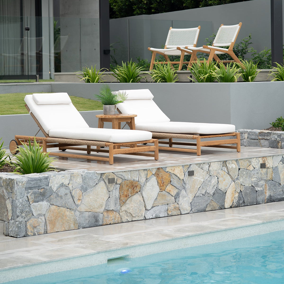 Vaucluse Outdoor Sunlounger in Grade A teak with white Sunbrella cushion, adjustable backrest and wheels, durable coastal outdoor furniture for poolside or garden relaxation. Resort style living.