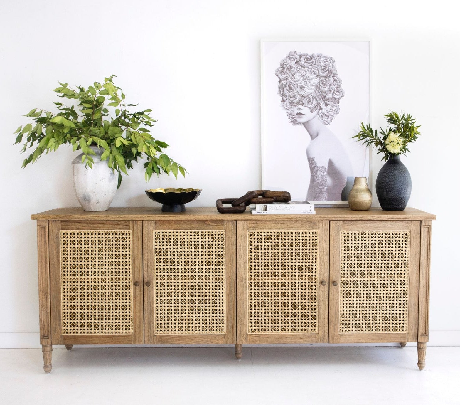Coastal living room styled with weathered oak rattan sideboard and neutral decor
