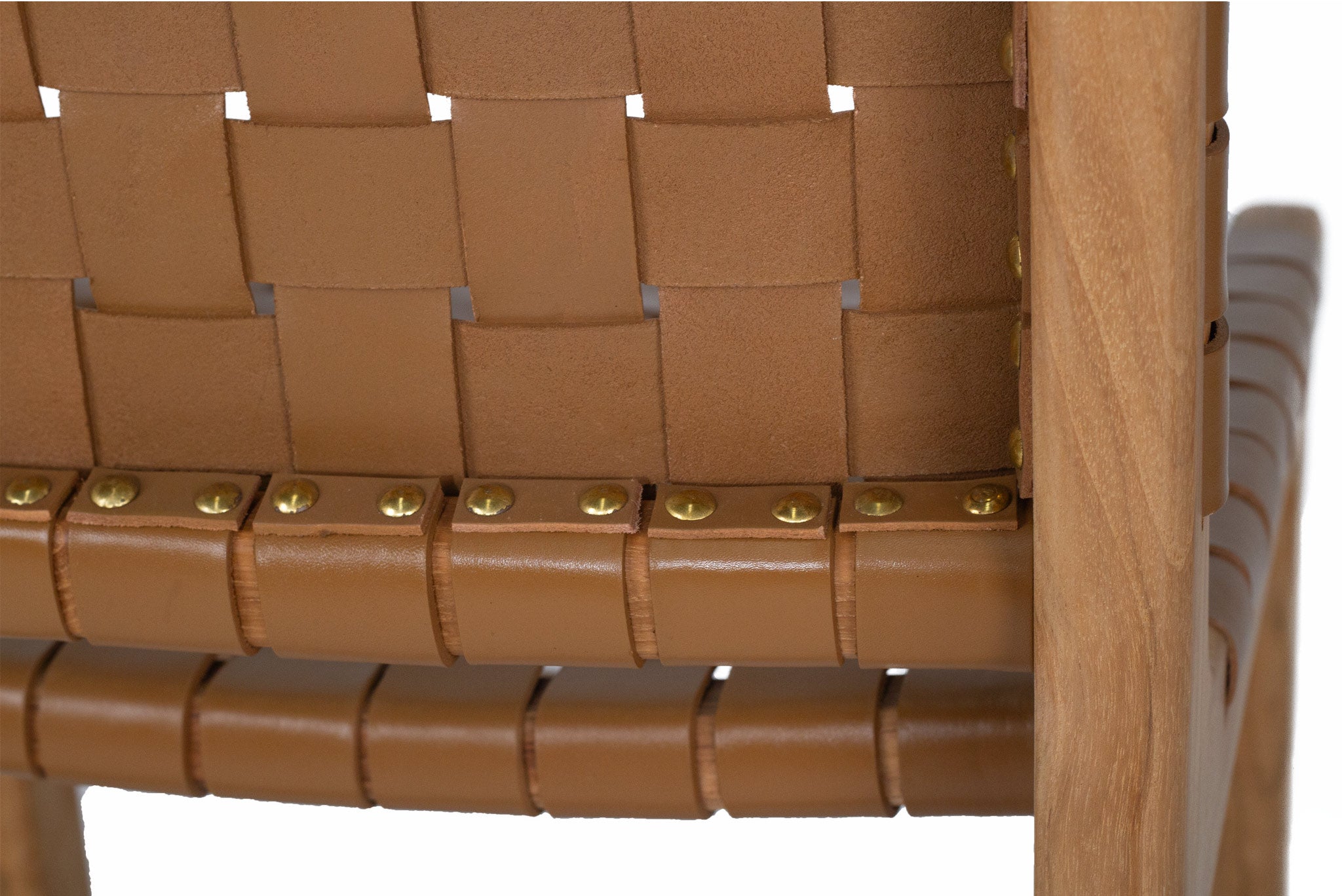 Tan woven leather high back counter stool with sleek modern design, durable and comfortable seating. Back of backrest close up. Magnolia Lane