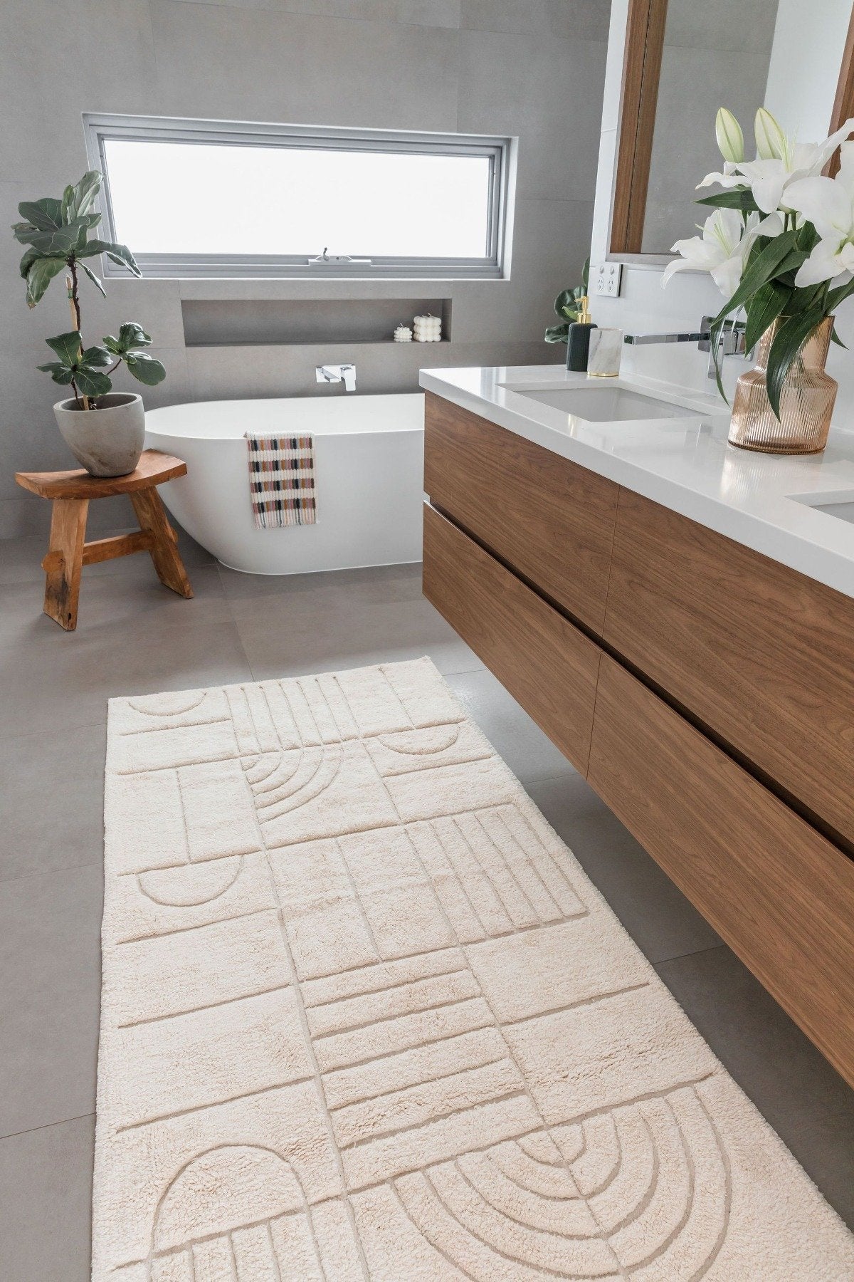 Extra large natural bath runner placed in front of timber vanity – textured cotton bath mat in modern interior