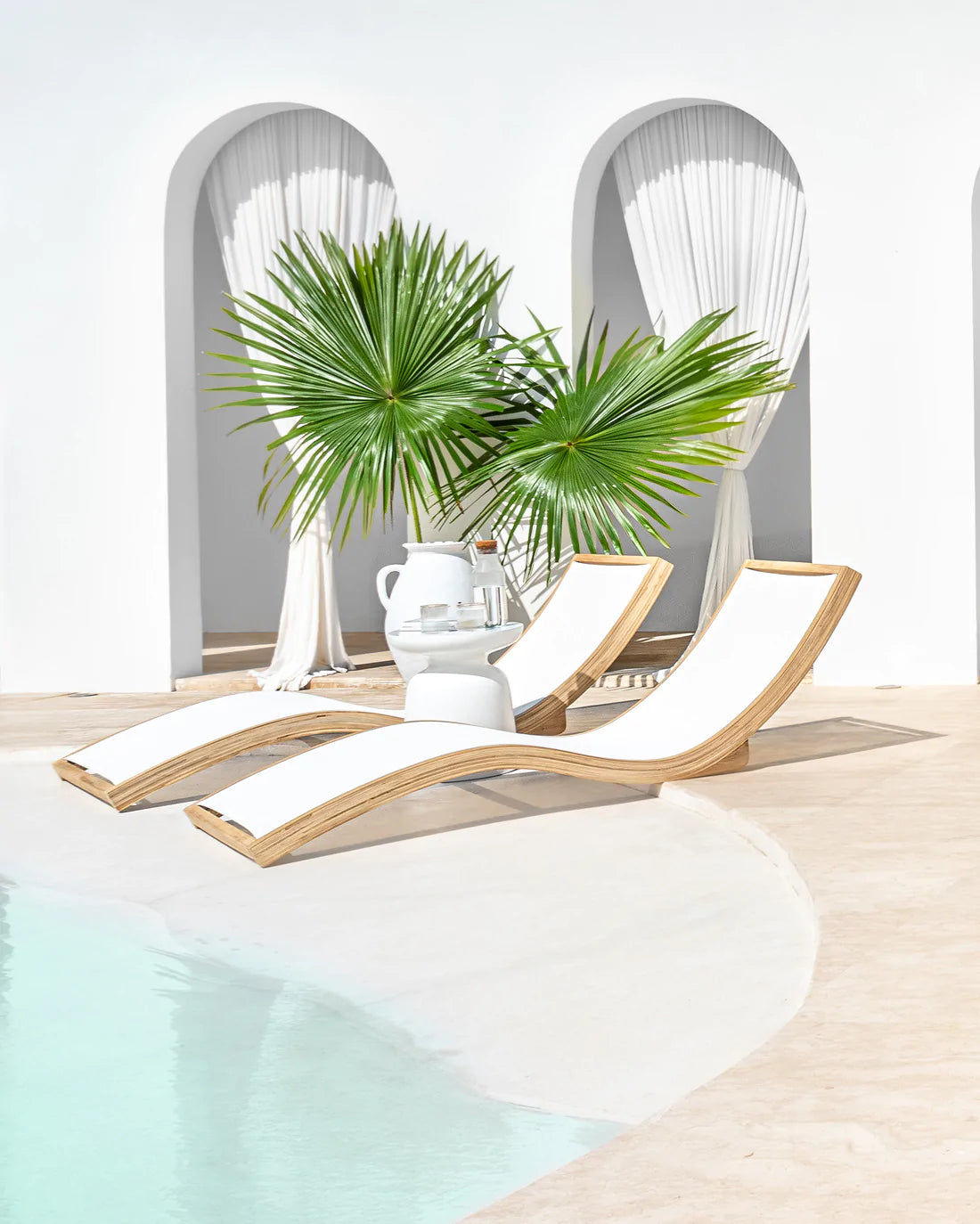 Akoni Large Side Table in white resin by Uniqwa Collections, mid-century inspired design, lightweight and durable, perfect for modern indoor or outdoor spaces. Magnolia Lane poolside furniture
