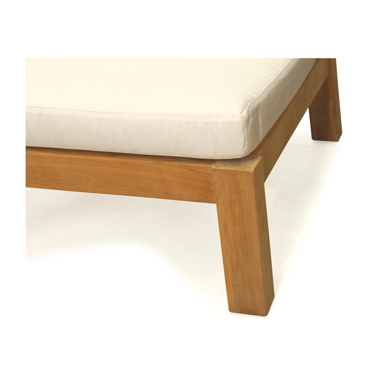 Bedarra teak outdoor armless single seater, close-up of the teak leg, side rail and cushion edge