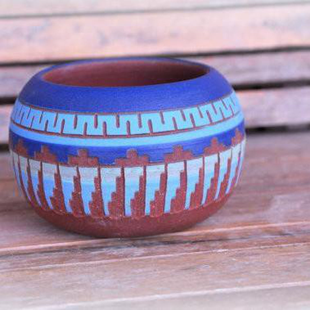 Handcrafted clay pots with desert and turquoise hues, featuring Native American-inspired Aztec and geometric patterns, durable and ideal for modern or eclectic interiors. Magnolia Lane