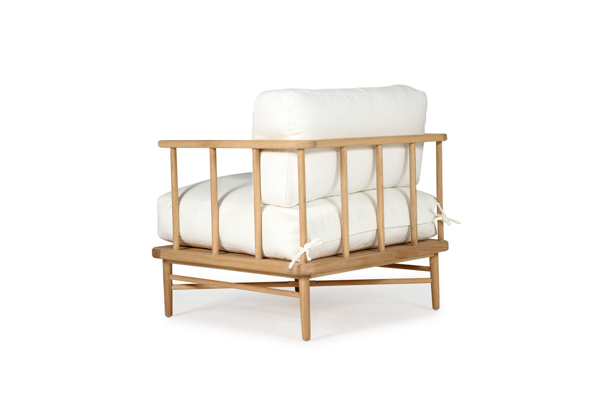 Harbour Island Indoor Armchair + Ottoman, rear angle view.