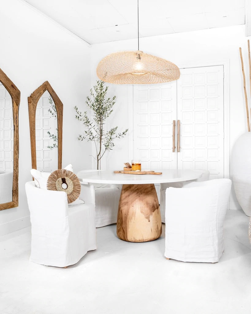 Karoo Mirror by Uniqwa Collections, handcrafted from rare antique Indonesian teak ploughs, showcasing unique shapes and rich cultural heritage. Styled perfectly in this beautiful coastal luxe interior.