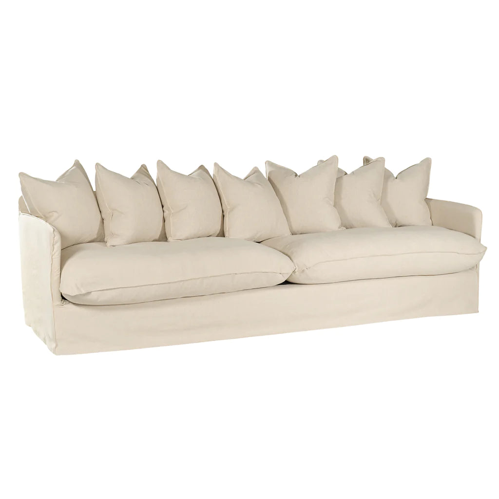 Singita Four Seater Sofa by Uniqwa with hardwood frame, feather-filled cushions and removable slipcovers in luxury linen in sand.