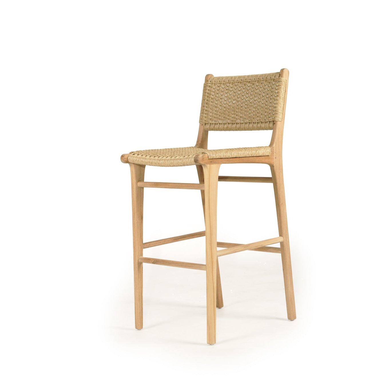 Cable Beach outdoor bar stool with woven back and teak frame in sand – angle view
